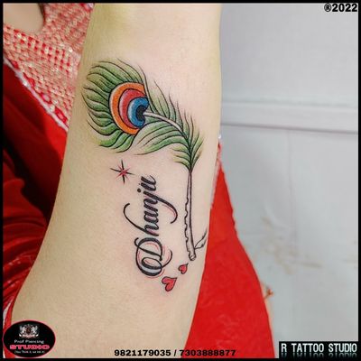 #featherdesign #tattoo #peacockfeathertattoo #peacocktattoo #feathertattoo #colourfulfeathertattoo #nametattoo #calligraphytattoo #featherdesign #tattoopeacockfeather #with #nametattoo #feather #tattoo #tattooday #tattooart #tattoogirl #tattoodesign 