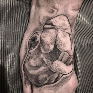 Elegant black_and_gray camel tattoo on foot, expertly done by Rico Dionichi. This illustrative piece showcases stunning realism.