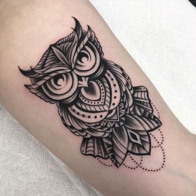 Embrace the mysterious allure of the owl with this detailed blackwork piece by Chris Tambo. Perfect for nature lovers and night owls alike.