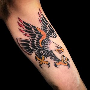 Get a stunning illustrative eagle tattoo on your upper arm by renowned artist Chris Tambo.