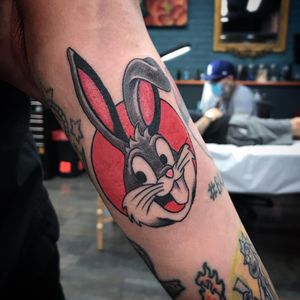Fun and colorful new school tattoo of Bugs Bunny on forearm by Chris Tambo. Illustrative style.