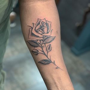 Beautiful blackwork flower tattoo by artist Chris Tambo, perfect for your forearm.