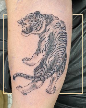 Get a fierce Japanese tiger tattoo in black and gray style on your arm in London, GB. A stunning and powerful choice.