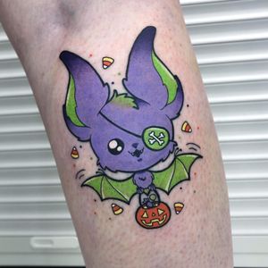 Get spooked with this neo traditional illustrative tattoo featuring a bat, pirate, and pumpkin on your lower leg in London, GB.