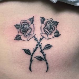 Get a beautifully detailed flower tattoo on your stomach in London, GB. Enhance your body with elegant floral art!