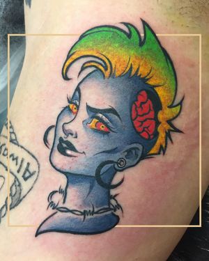 Illustrative arm tattoo of a punk woman with a brain, earrings, and collar, done in London, GB.