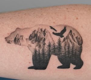 Bear silhouette tattoo with trees, mountains, and birds. By Chris Xu at MODO INK #blackandgray #bear #nature #tattoo #birds #mountains #trees