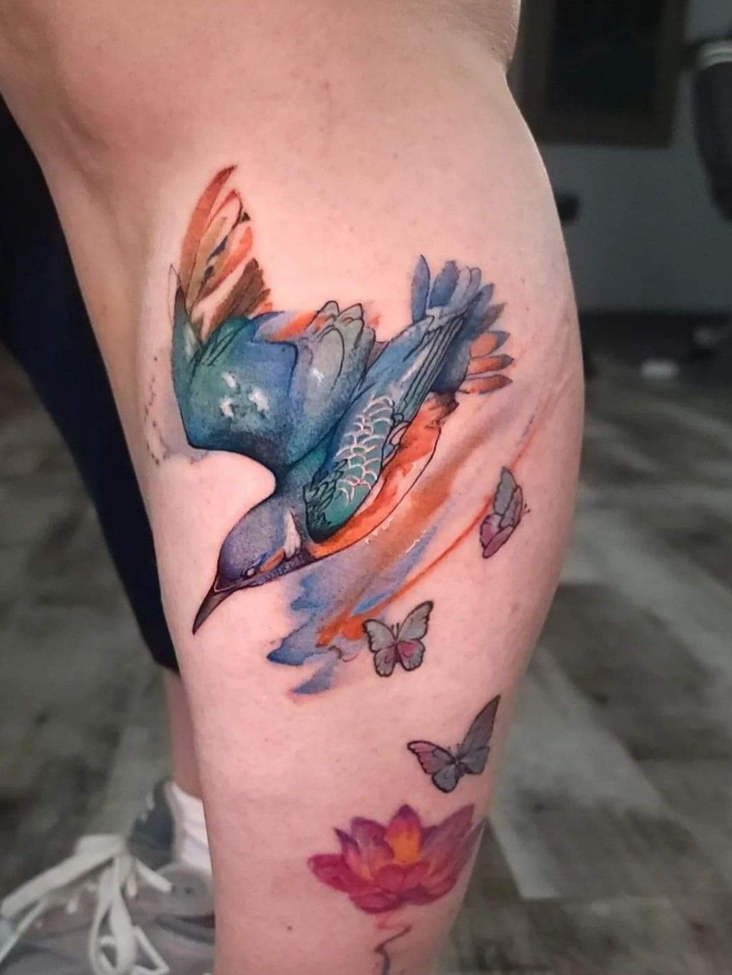 Blue cardinal tattoo on the tricep