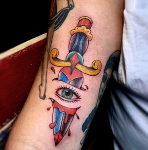 Traditional eye dagger tattoo in color. 