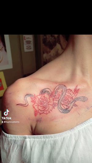 Snake thru rose on collarbone…#snaketattoos #rosetattoos #byjncustoms