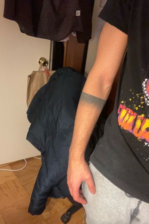 Simple faded bar tattoo. Working to incorporate into an entire arm sleeve