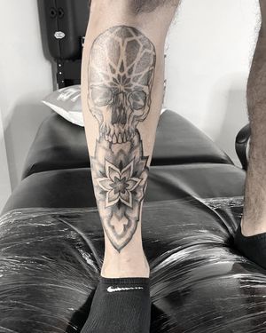 Unique shin tattoo by Lawrence, featuring intricate dotwork and illustrative design.