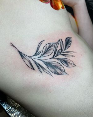 Get a delicate leaf motif tattooed on your ribs in London for a subtle and elegant look.