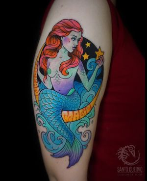 Capture the beauty of the ocean with this stunning neo-traditional mermaid tattoo on your upper arm in London.