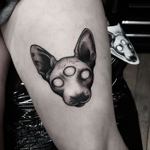 Get an edgy and colorful new school cat tattoo on your upper leg in London, GB. Stand out with this creative design!