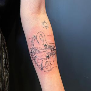 Capture the beauty of nature with this delicately detailed forearm tattoo featuring a sun, bird, and duck in fine line illustrative style. Located in London, GB.