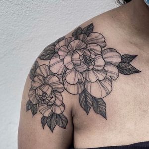 Get a beautifully intricate floral peony tattoo on your shoulder in London, GB. Perfect for adding a touch of elegance to your body art.