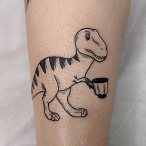 Get a unique fine line tattoo of a t rex holding a cup on your forearm in London, GB. Detailed and illustrative design.
