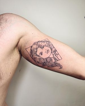 Capture the beauty of London with this fine line illustrative tattoo of a woman on your upper arm. Perfect for those looking for a sophisticated and elegant design.