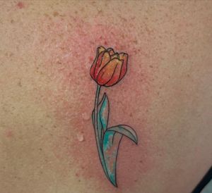 Tulip tattoo #fineline #watercolourtattoo #tuliptattoo #amsterdamtattoo