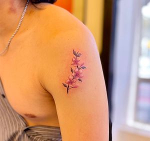 Realistic color flower micro tattoo