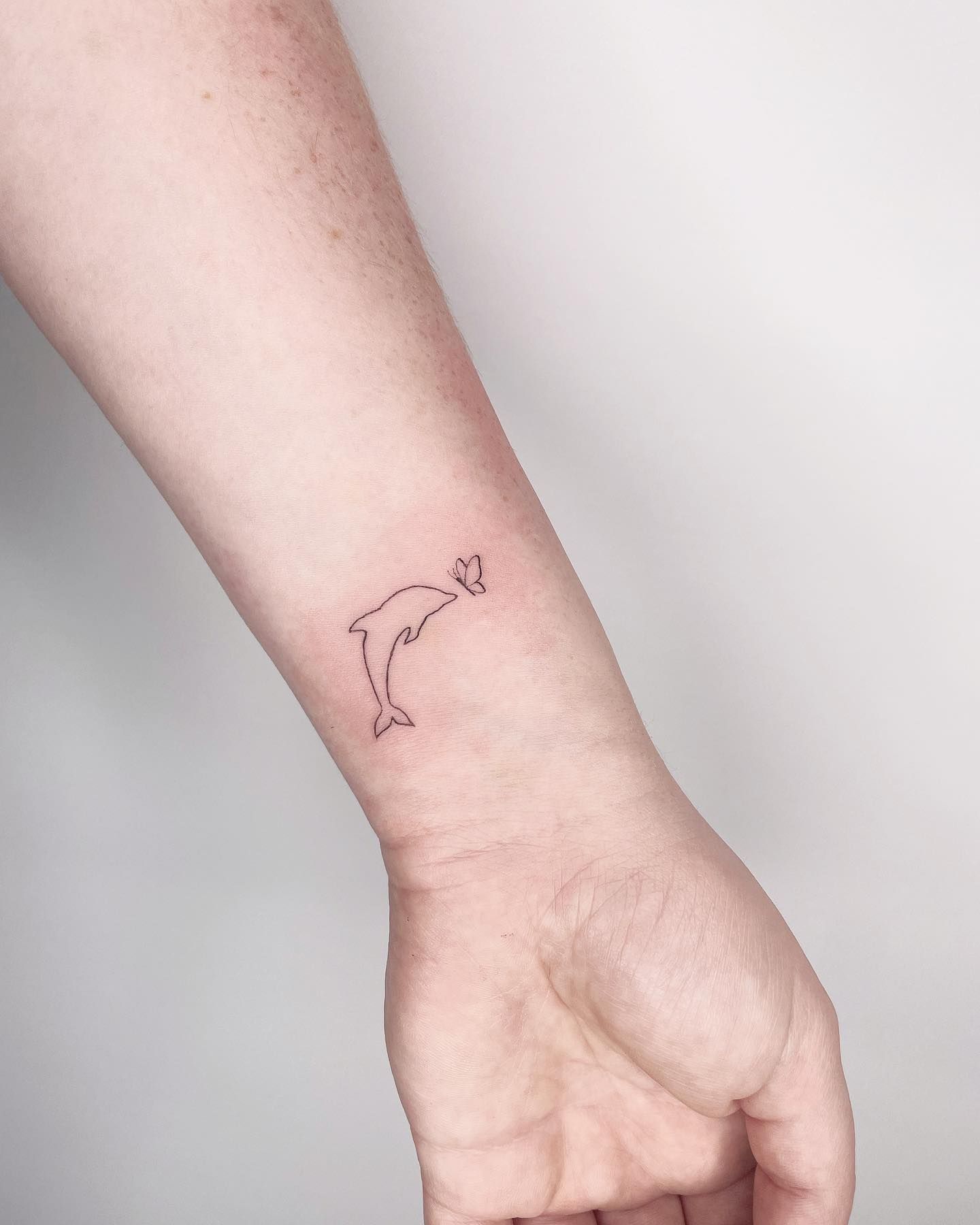 Dolphin' in Fineline Tattoos • Search in + Tattoos Now • Tattoodo
