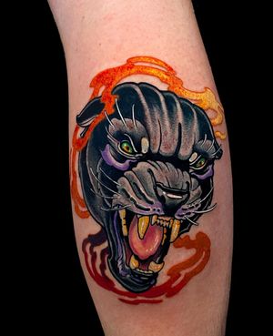 Experience the power and grace of a neo-traditional panther tattoo on your lower leg by talented artist Jethro Wood.