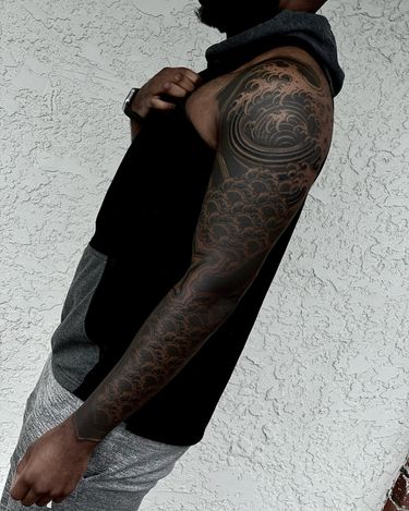 Blackwork tattoo style chest arm design  Solid black tattoo, Black sleeve  tattoo, Full sleeve tattoos