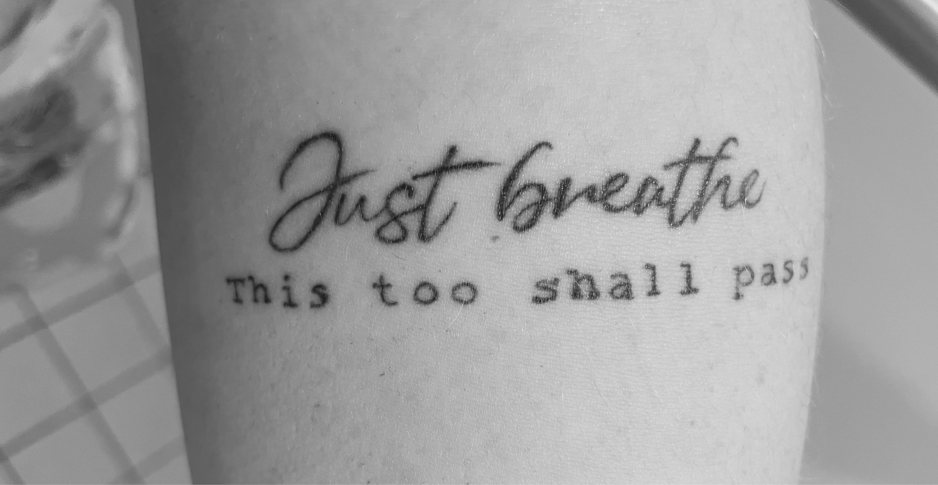 This too shall pass tattoo on the inner forearm