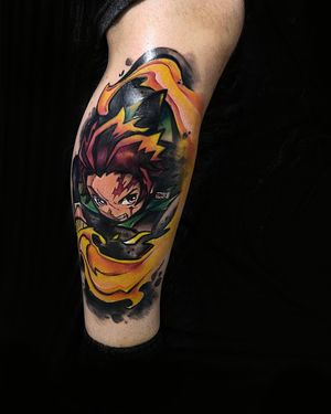 Vibrant new school tattoo of Tanjiro wielding a sword, expertly executed by Artemis on the lower leg for dynamic impact.