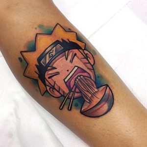 Vibrant and whimsical new school tattoo on forearm featuring a noodle bowl, chopsticks, and cameo by Naruto.