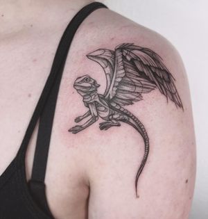 Unique blackwork and fine line dragon illustration on shoulder by Polina.
