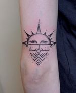 Symbolic sun tattoo