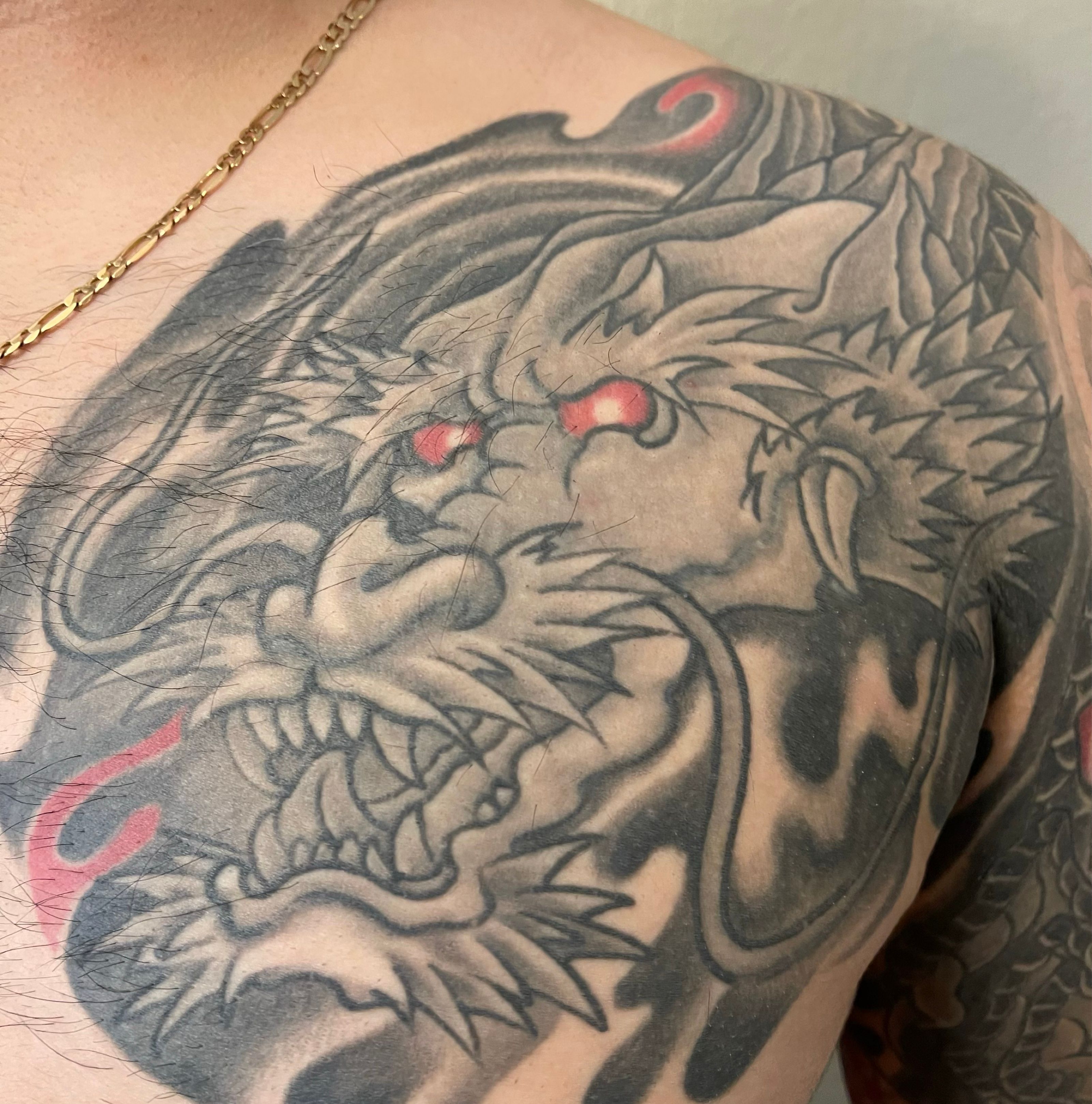 Lexica  a dragon tattoo on arm