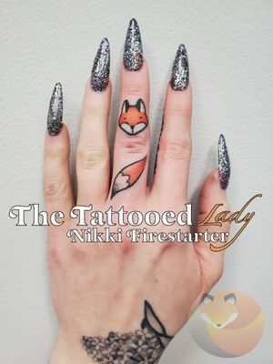 I finally fixed and finished the fox I did on my middle finger lol. It was pointed out to me that there will be a lot of close-up photos of this hand during my wedding in September, so I figured I should get this done! All the color fill is dotted in, as that should stick more easily than color packing on a finger. 🦊....#tattoos #BodyArt #BodyMod #modification #ink #art #QueerArtist #QueerTattooist #MnArtist #MnTattoo #TattooArt #TattooDesign #TheTattooedLady #TattooedLadyMN #NikkiFirestarter #FirestarterTattoos #firestarter #MinnesotaTattoo #MNtattooers #DarkLab #FKiron #EternalInk #Saniderm #H2Ocean #FoxTattoo #FingerTattoo #MiddleFinger #illustrative #ColorTattoo #fox
