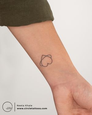 Minimal heart tattoo done by Neeta Khale at Circle Tattoo