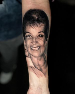 Get a stunning blackwork realism tattoo of a woman on your forearm in Miami, US. Perfect combination of art and style.