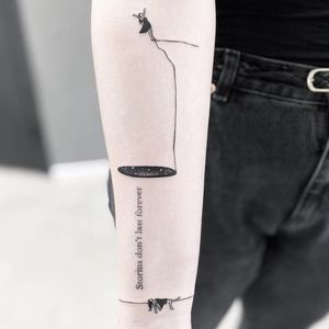 Get a beautifully intricate forearm tattoo of a girl in fine line style with small lettering in Los Angeles. Perfect for a modern and chic look.