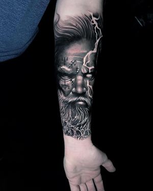 Get a stunning black and gray Zeus tattoo on your forearm in Miami, US. Perfect for lovers of Greek mythology and realistic artwork.