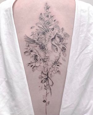 Get a stunning and intricate floral design featuring a peony and heron on your back. Visit a top tattoo artist in Los Angeles for this beautiful piece.