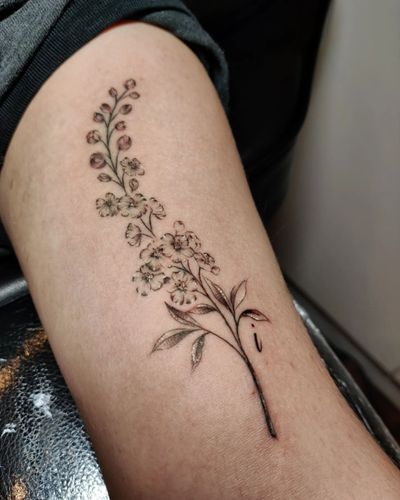 Beautiful illustrative lavender flower design on upper arm by Mary Shalla.