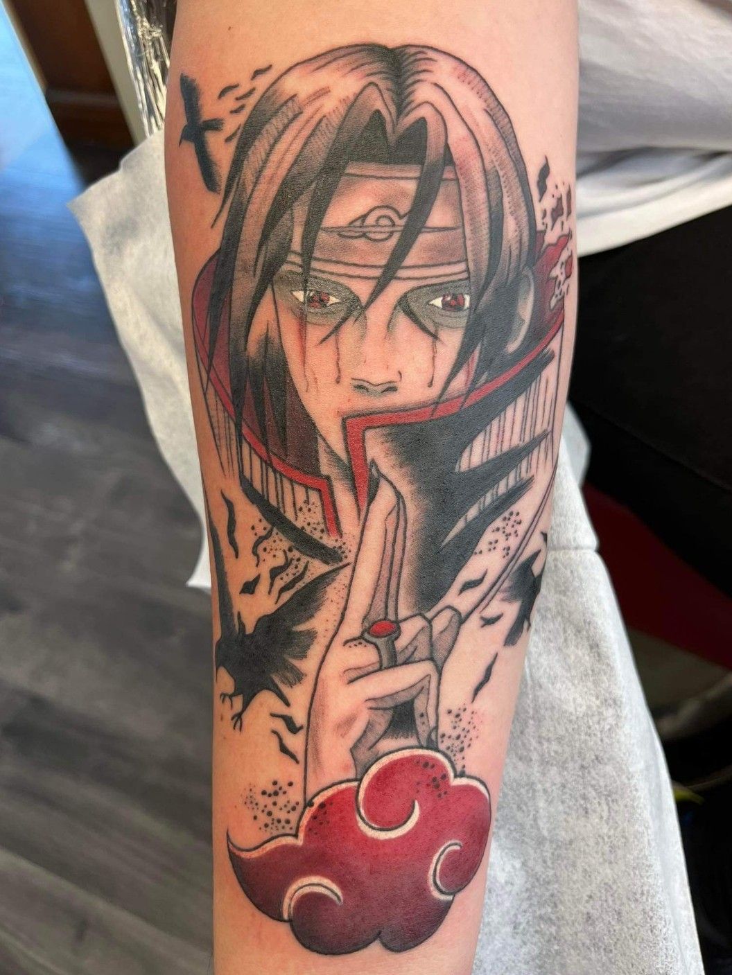 Itachi uchiha tattoo black and white and red glowing eyes on Craiyon