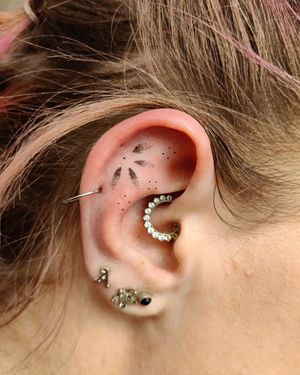 Get a unique pattern tattoo in dotwork style for your ear by talented artist Mary Shalla.