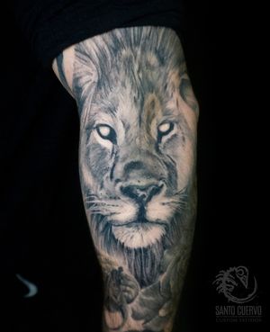 Get a fierce and realistic lion tattooed on your arm in London for a bold and majestic look.