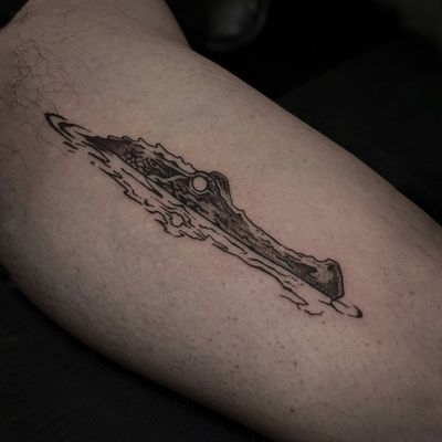 Get a sleek and stylish black and gray fine line alligator tattoo by the talented artist Luca Salzano.