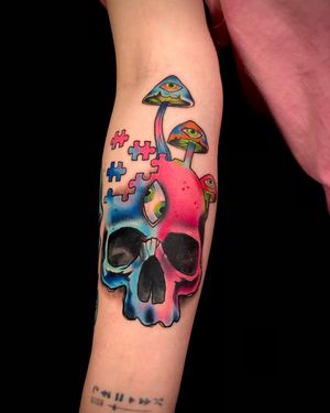 Vibrant new school tattoo by Sandro Secchin featuring a skull and mushroom design on the forearm.