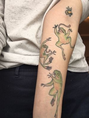 Healed frogs chasing a bee on my client for their first tattoo, and as a partial scar coverup 