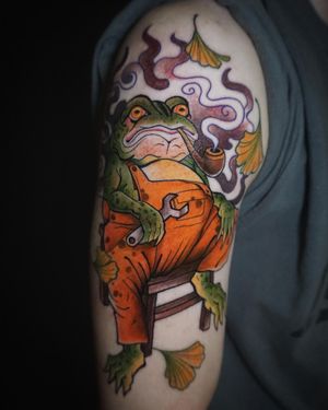 Experience the mystical allure of the Japanese culture with this exquisitely designed frog tattoo by Aygul. The intricate details and symbolism of the frog motif are sure to make a lasting impression.