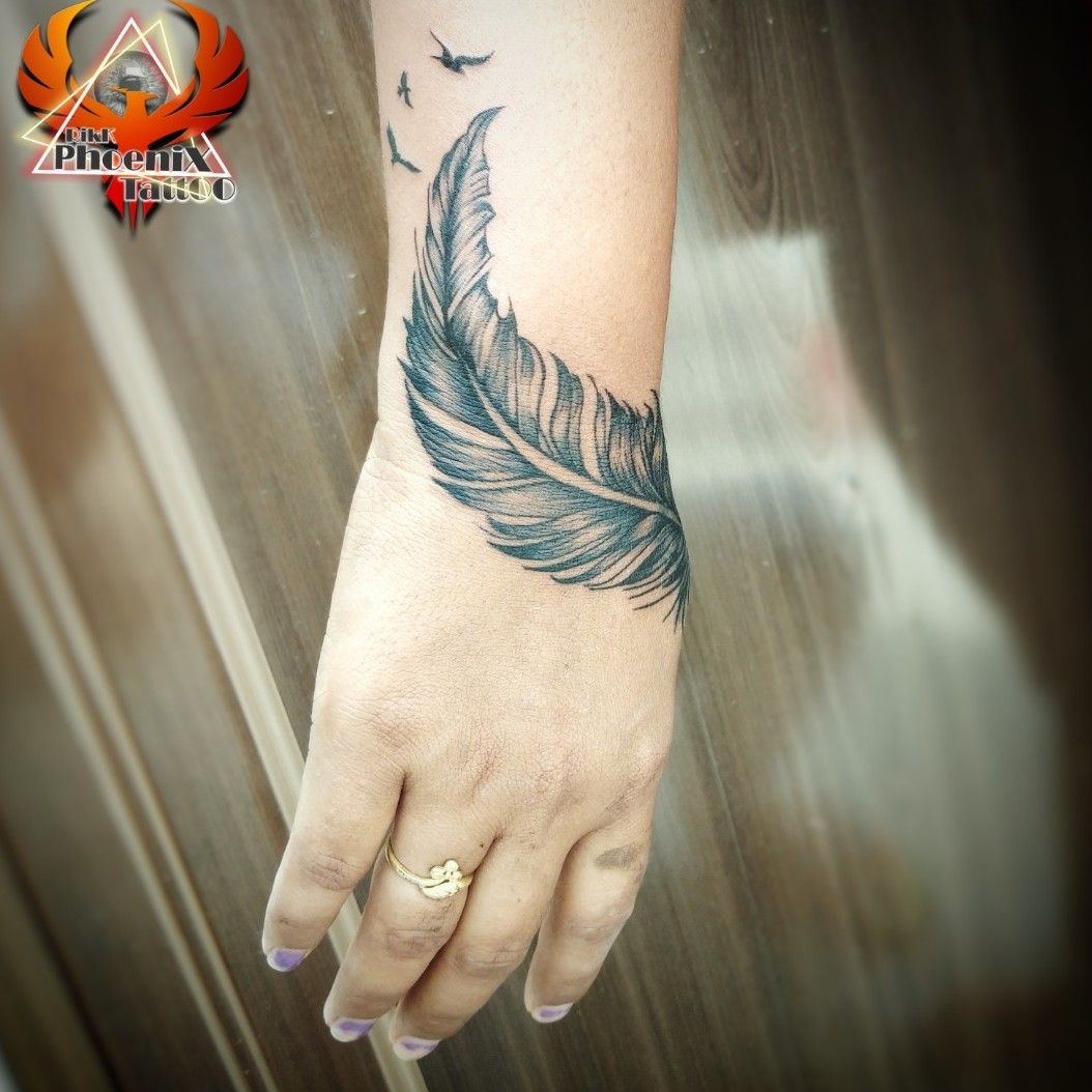 Mor Pankh Tattoo | Mor pankh tattoo, Feather tattoo black, Wrist tattoos  for guys