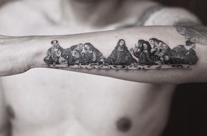 Gabriele Edu brings to life the iconic last supper scene in stunning black and gray on your forearm. Embrace faith and artistry in this detailed illustrative design.